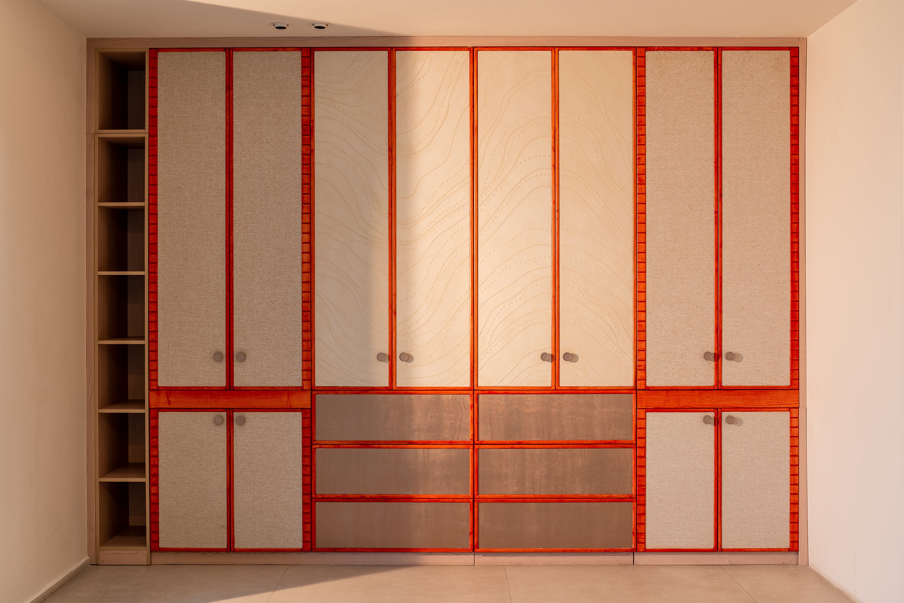 Large wardrobe with terracotta accents